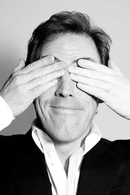 Rob Brydon covering his eyes shot in London
